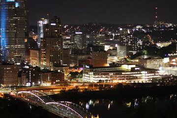 Fototapeta premium Birds eye view of the city skyline of downtown Pittsburgh, Pennsylvania at night.