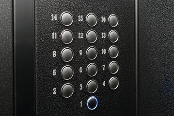 numbered floor buttons in elevator of multi-storey building © Anton Pentegov