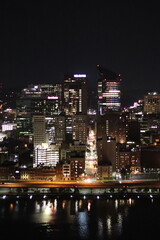 Fototapeta premium Birds eye view of the city skyline of downtown Pittsburgh, Pennsylvania at night.