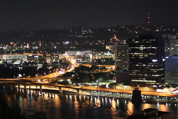 Birds eye view of the city skyline of downtown Pittsburgh, Pennsylvania at night.