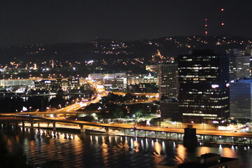 Birds eye view of the city skyline of downtown Pittsburgh, Pennsylvania at night.