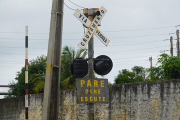 Dangerous railroad crossing (Cruzamento Ferrea) on a busy main street in Fortaleza, Brazil. Traffic...