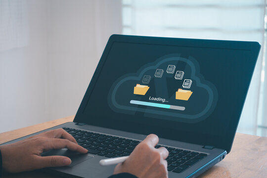 Transfer files data system relocation cloud technology concept. Backup, exchange, share. Person hand using laptop computer waiting for transfer file process with loading bar icon on virtual screen. - Powered by Adobe