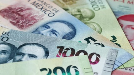 Mexican money turnover, batch of different peso banknotes. Concept of financial success, lottery or big win.