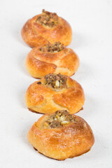 Open pie filled with fish, eggs and onions