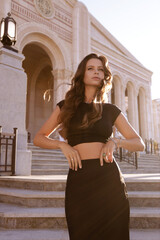 beautiful slavic woman in elegant dress and accessories posing in antic style villa