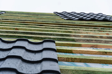 Sheets of metal tile on the frame, roof close-up