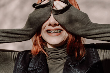 Smiling Redhead Teen Girl with Braces Posing in Warm Winter Clothing
