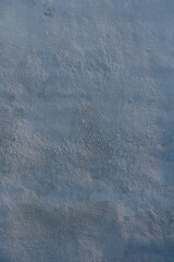 Obraz premium Texture of a tranquil surface reflecting soft hues at dawn near the calm lake