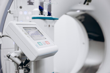 Contrast agent and CT scanner before diagnostics in the room. The concept of using modern...