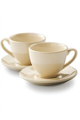 Obraz premium Two beige coffee cups and saucers, elegantly arranged on a white background.