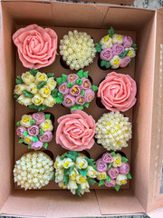 Decorative Flower Cupcakes Arranged in Boxes