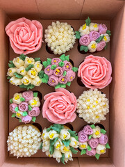 Decorative Flower Cupcakes Arranged in Boxes