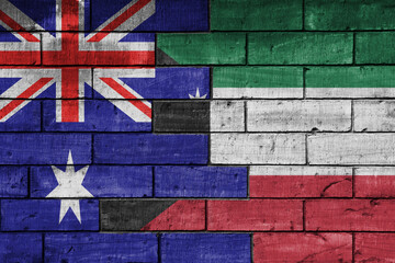 colourful painted big flag of australia and flag of kuwait on a massive old brick wall background. concept