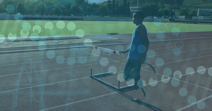 Athlete with prosthetic leg on track with data processing image over scene - Powered by Adobe