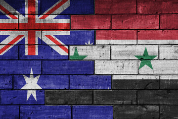 colourful painted big flag of australia and flag of syria on a massive old brick wall background....
