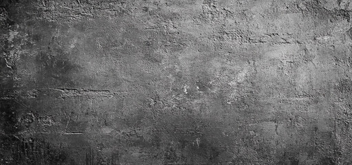 Grunge gray concrete wall texture with dark industrial background creates a rough and aged surface perfect for overlay