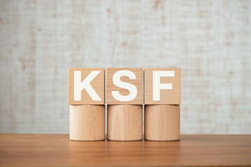 There is wood cube with the word KSF. It is an abbreviation for Key Success Factor as eye-catching...