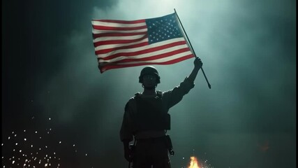 Special forces soldier standing in the dark and raising up USA national flag - Powered by Adobe