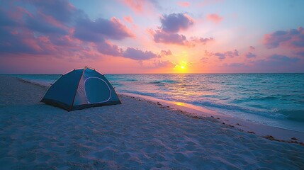 Tent at sunset on beach.