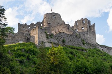 Fototapeta premium View of an old dilapidated medieval castle on top of a mountain in the Austrian Alps. Mountain landscape with a castle.