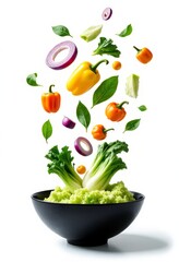 Vegetables falling into black bowl with lettuce base