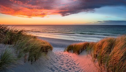 Sunset over tranquil beach with dunes,  peaceful scene.