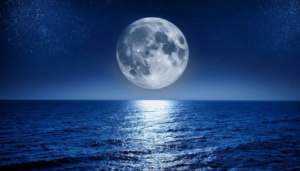 Full moon over tranquil ocean at night.