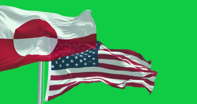 Flags of Greenland and the US waving isolated on green background
