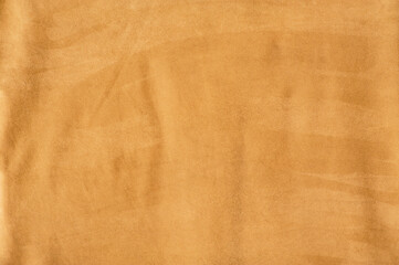 The texture of suede is mustard-colored. Natural leather texture.