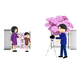 桜が咲く小学校の入学式。校門の前に立ち、記念写真を撮影する親子