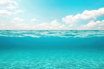 Obraz premium Blue ocean with white clouds and gentle waves under a clear sky during a sunny day