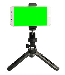 Mini tripod with green screen Mobile phone  isolated on a white background