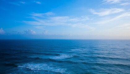 Obraz premium Vast Ocean Serenity: A Breathtaking View of the Tranquil Blue Sea Under a Calm Sky