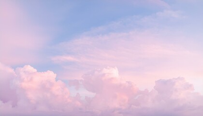 Soft pink clouds drift across a pastel sky.