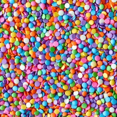 Vibrant Confetti of Assorted Colorful Candies and Sweets Scattered against a Festive Background