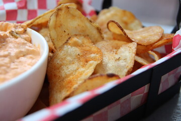 Chips and dip on a plate in a restaurant	