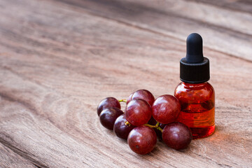 Grape seed essential oil on table
