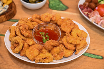 Greek-style fish and seafood platter in a tavern in Romania, 2025