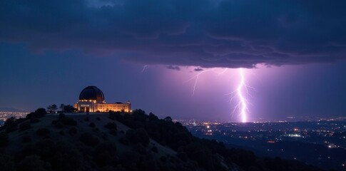 Obraz premium Darkened sky with lightning strike behind Griffith Observatory at night, California, Los Angeles, flash of light