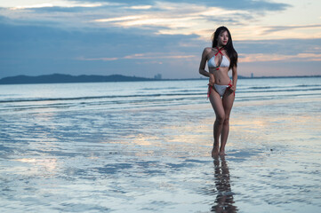 girl on the beach at sunset. woman on the beach