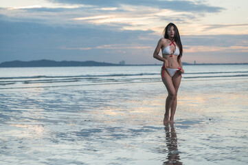 girl on the beach at sunset. woman on the beach