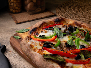 Homemade Sourdough pizza on Wooden Table.
