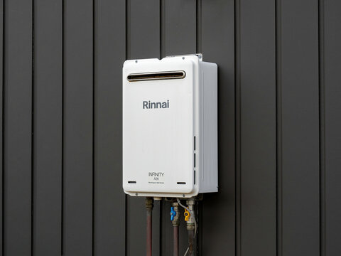External continuous flow gas water heater, Rinnai A26 26L Heater. Auckland, New Zealand - January 26, 2025