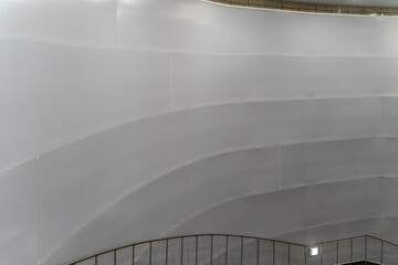 Architectural elements like walls and fences with diverse designs defining exterior and interior spaces.