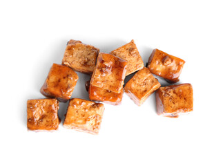 Pieces of fried tofu cheese with soy sauce on white background