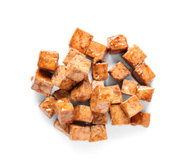 Pieces of fried tofu cheese with soy sauce on white background