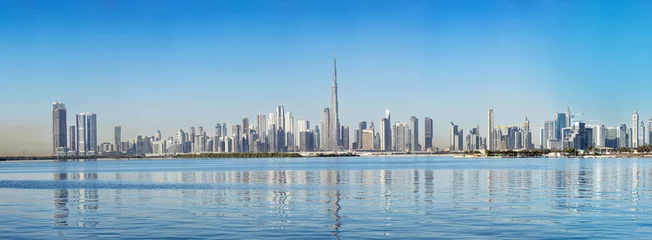Fototapete Skyline Panoramic view of Dubai's skyline as seen from Dubai Creek Harbour  © Peter