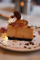 Plated slice of chocolate cheesecake at an upscale restaurant in downtown Minneapolis, Minnesota.