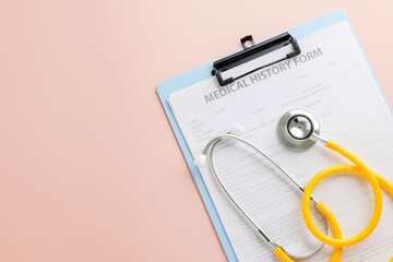 Doctor Day highlights a clipboard with a medical history form and yellow stethoscope on pink
